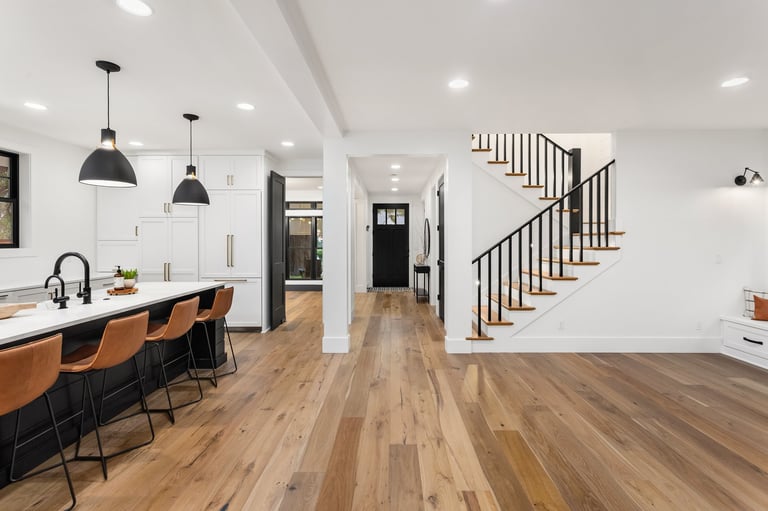 Kitchen in newly constructed luxury home with hardwood flooring