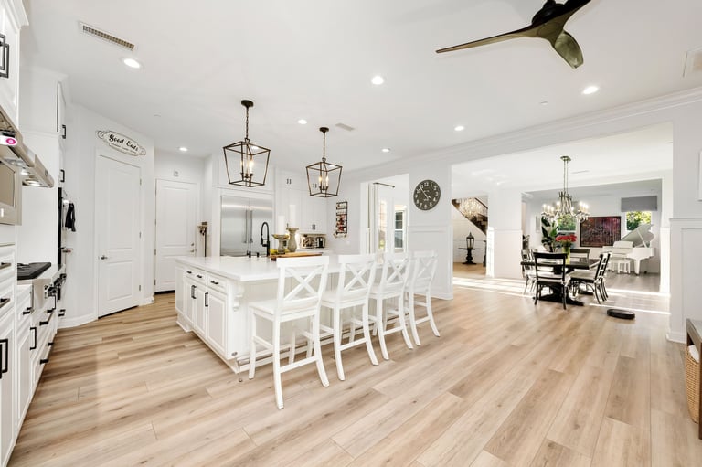 A bright and elegant open-concept living space with modern furnishing in a luxury home